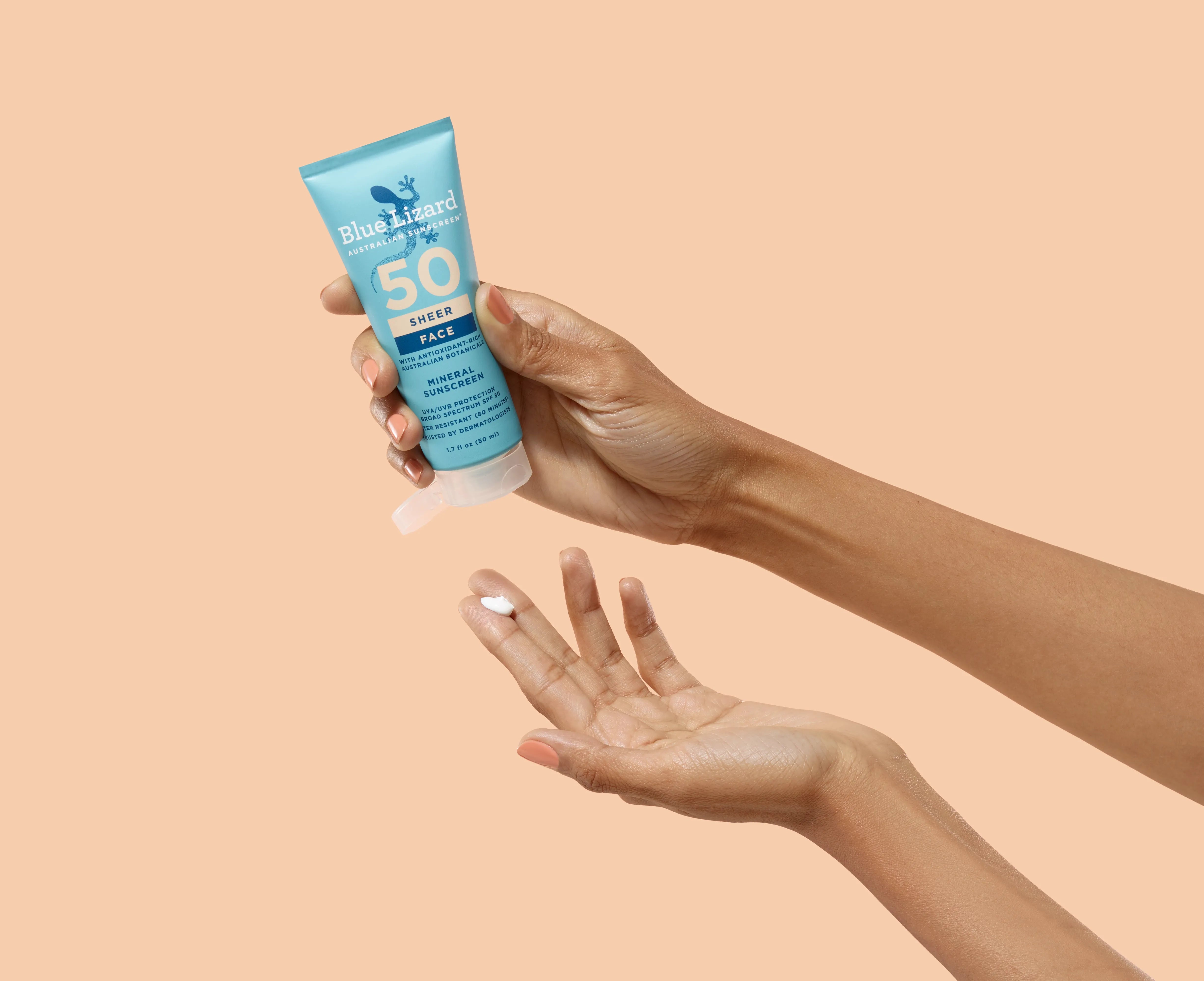 Hand dispensing Blue Lizard SPF 50 sunscreen.