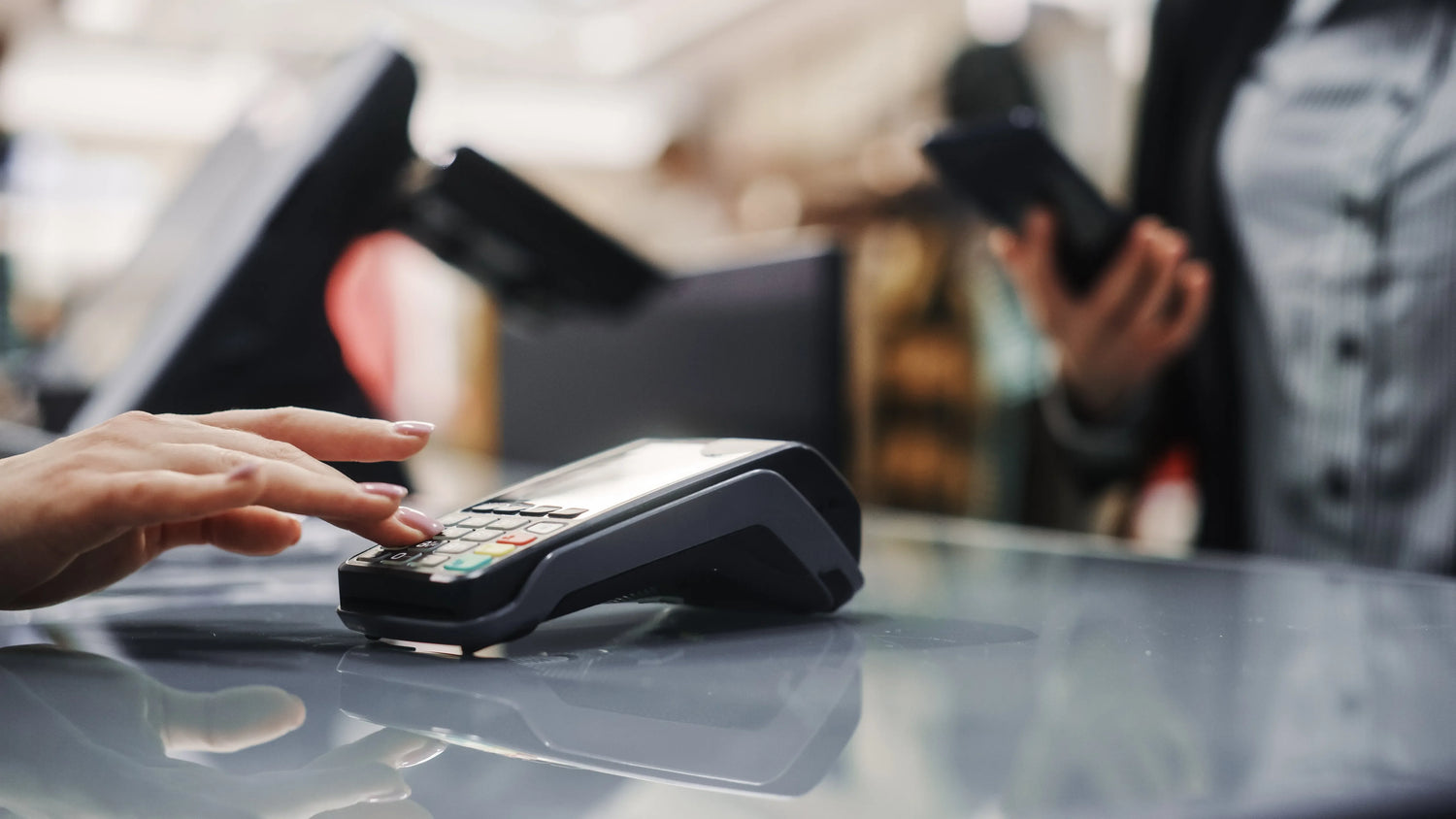 Person using a card reader for payment