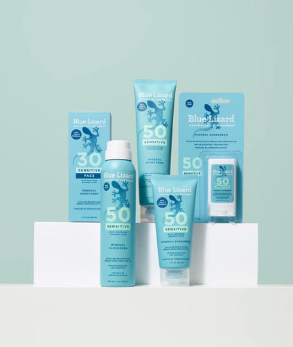 Blue Lizard mineral sunscreen sensitive collection on a green background