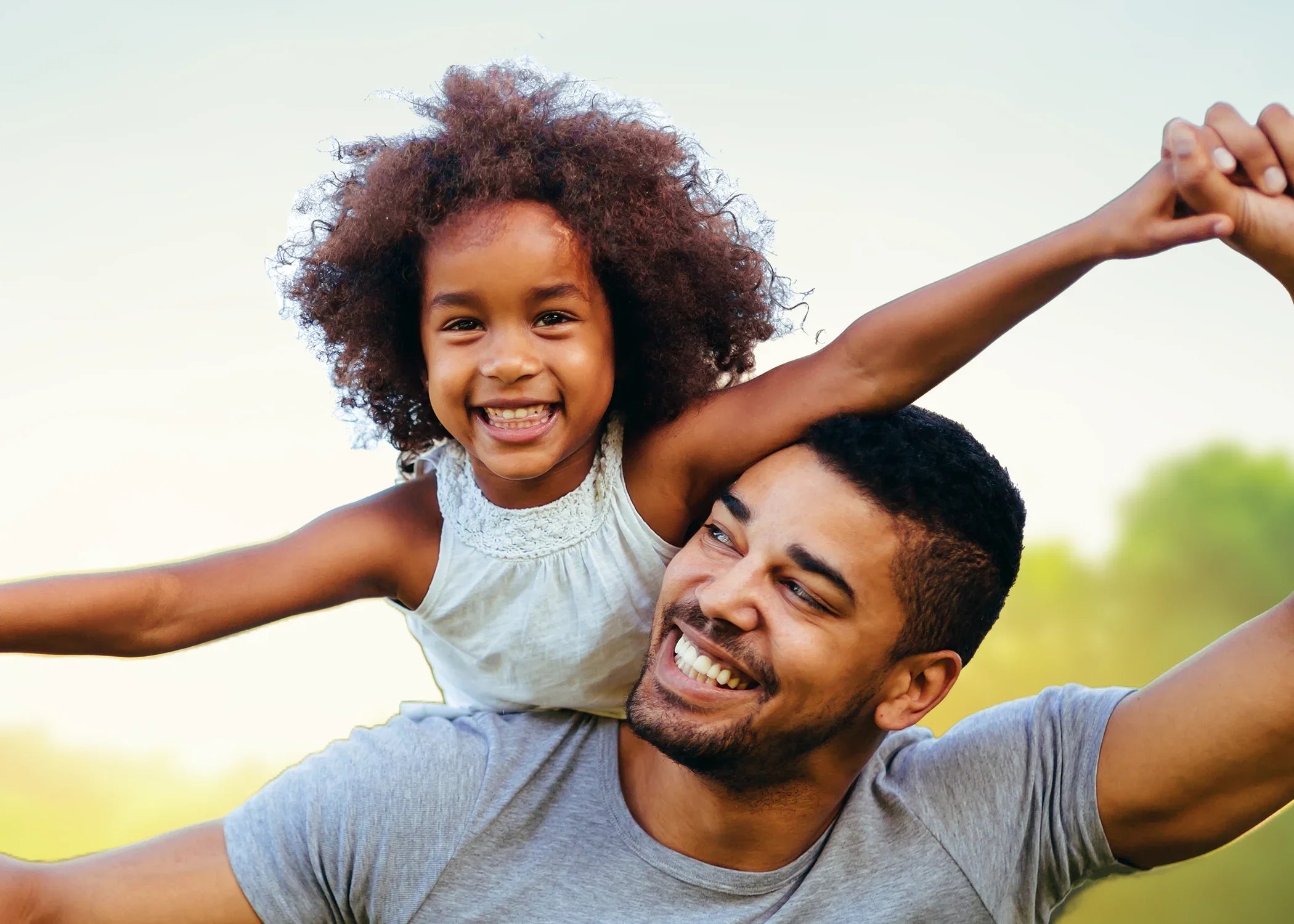 A man and a child smiling