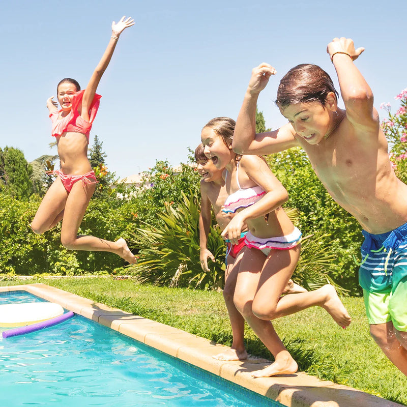 Kids jumping into the swimming pool