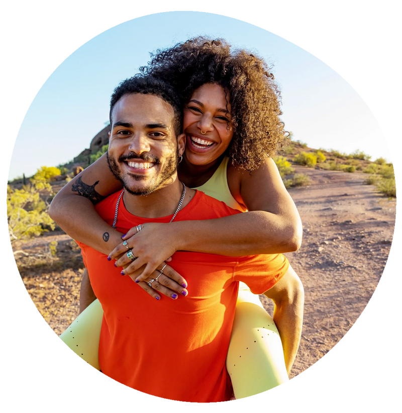 A couple in sports clothes smiling