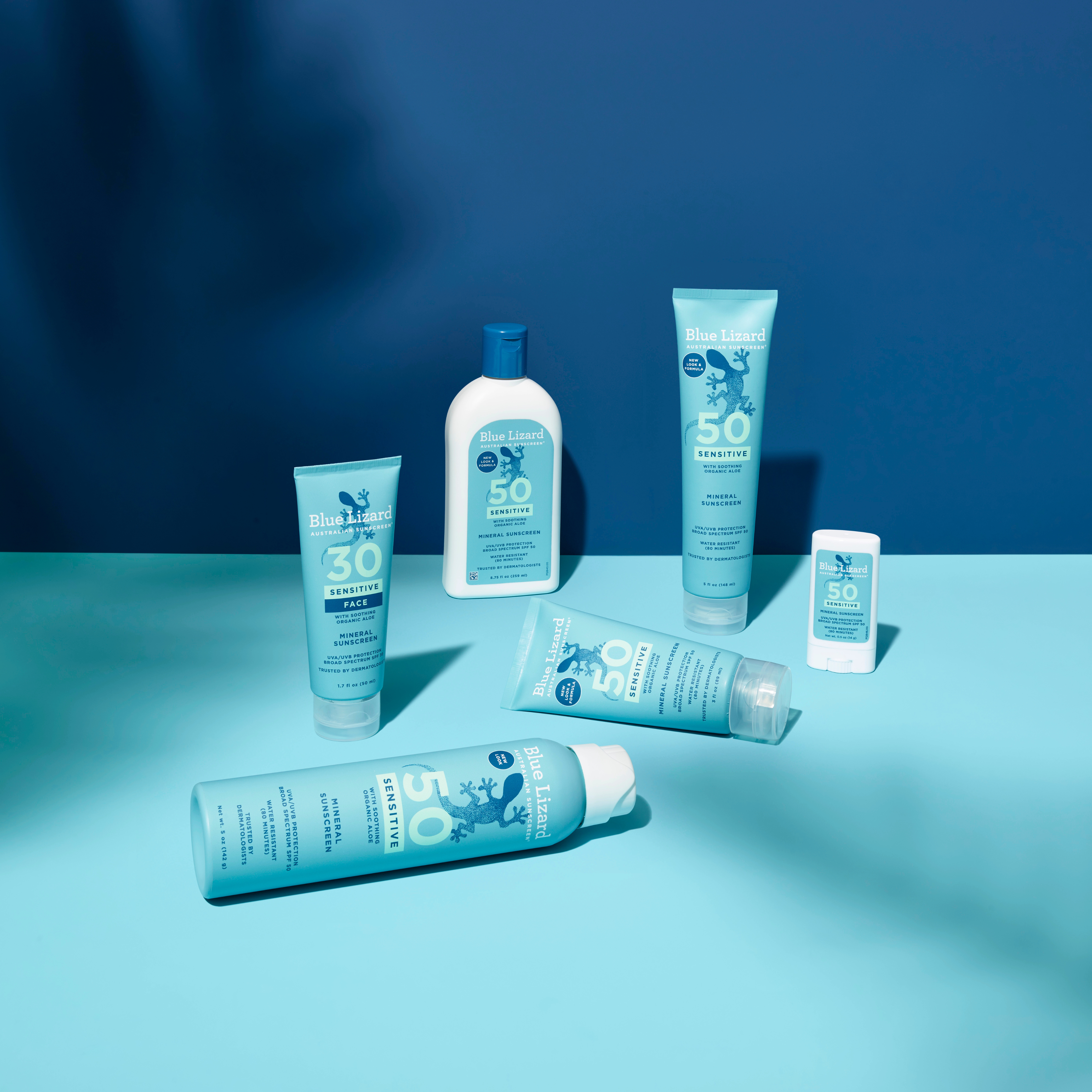 Blue Lizard mineral sunscreen sensitive collection on a blue background