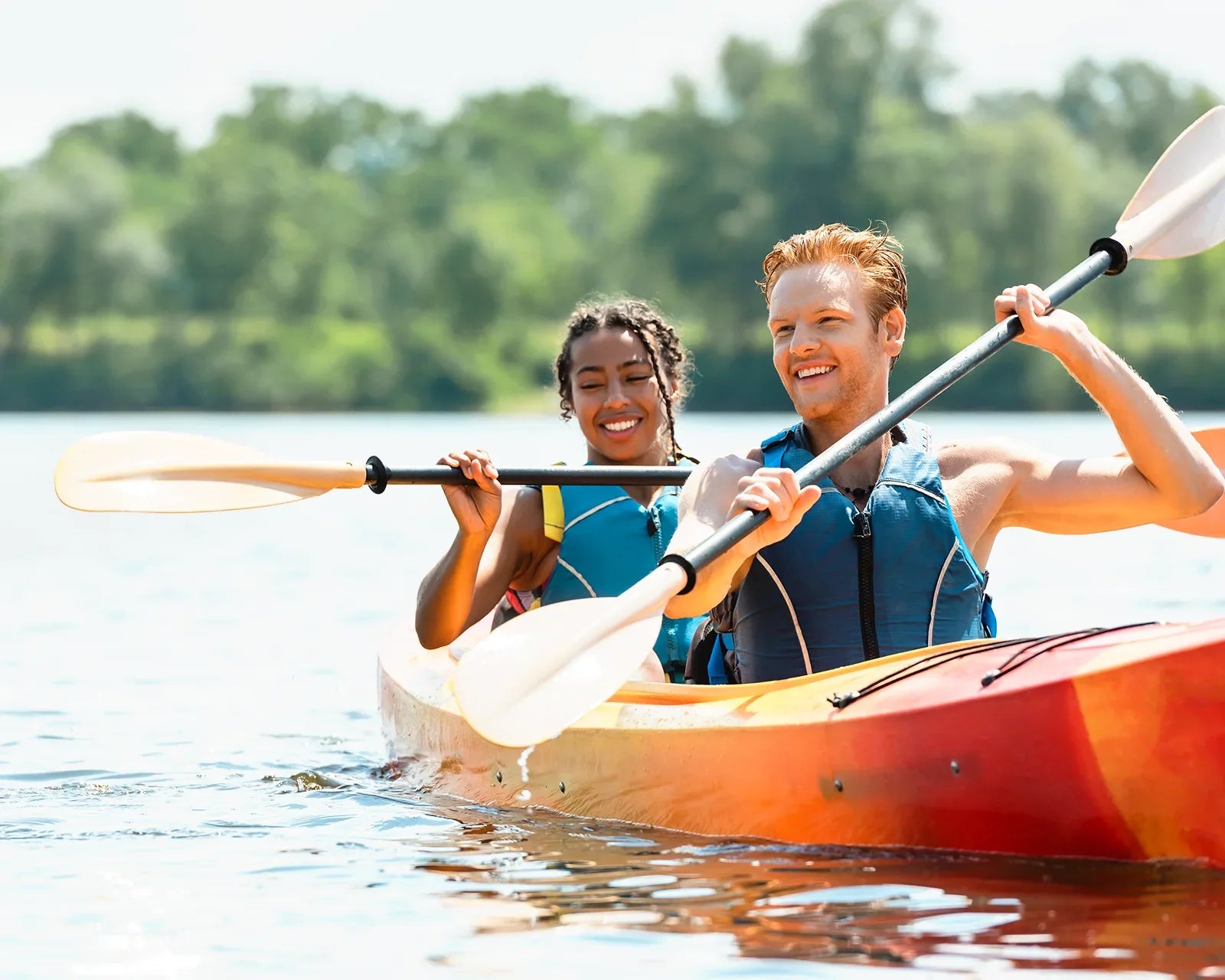 A couple kayaking on a lake